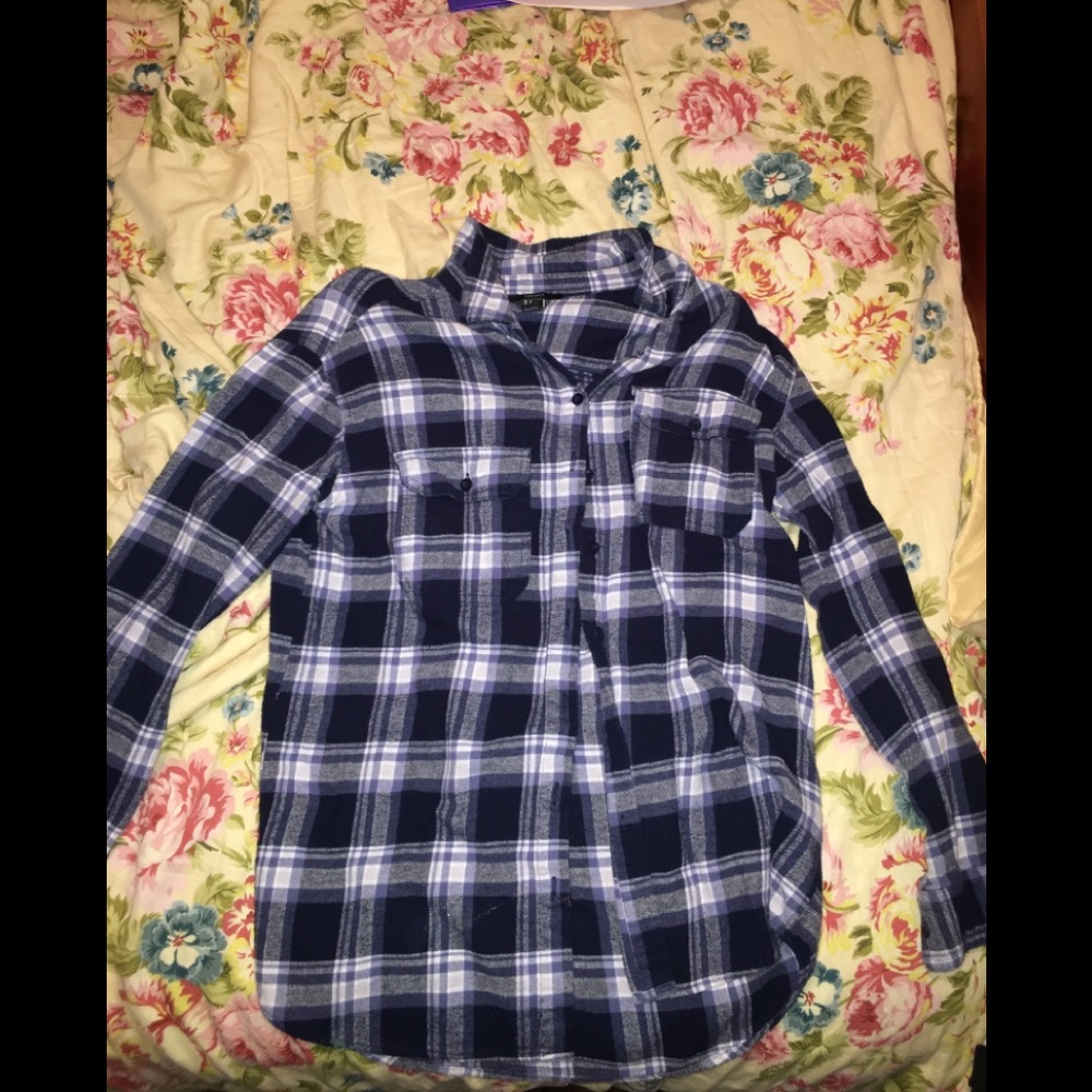 A long sleeve fleece button up shirt, worn once